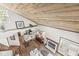 Open-concept living space with a wooden ceiling, fireplace, and kitchen view from above, providing a spacious feel at 7786 Harbour Isle, Indianapolis, IN 46240