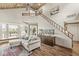 Bright living room features a vaulted wood ceiling, a staircase, and plenty of natural light from a large window at 7786 Harbour Isle, Indianapolis, IN 46240