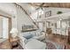 Open-concept living room flows into the kitchen and dining area, featuring a vaulted wood ceiling and staircase at 7786 Harbour Isle, Indianapolis, IN 46240