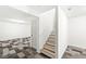 Finished basement featuring neutral walls, carpet flooring, and a staircase leading upstairs at 7829 Hedgehop Dr, Zionsville, IN 46077