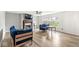 Bright living room features a fireplace, large windows, and comfortable blue furniture for relaxing at 7829 Hedgehop Dr, Zionsville, IN 46077