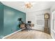 Bright office space with unique green wall and vintage grandfather clock adding character and charm at 7829 Hedgehop Dr, Zionsville, IN 46077