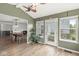 Inviting sunroom with hardwood floors, vaulted ceilings, and views of the backyard at 7829 Hedgehop Dr, Zionsville, IN 46077