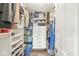 Well-organized walk-in closet with custom shelving and ample storage space for clothing and accessories at 7829 Hedgehop Dr, Zionsville, IN 46077