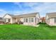 Expansive backyard with a well-maintained lawn and a patio perfect for gatherings and outdoor enjoyment at 793 Shepherds Way, Greenwood, IN 46143