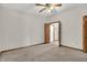 Spacious bedroom with neutral carpet, ceiling fan, and doorway to hallway at 793 Shepherds Way, Greenwood, IN 46143