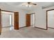 Spacious bedroom with neutral carpet, ceiling fan, and wood trim throughout at 793 Shepherds Way, Greenwood, IN 46143