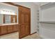 Walk-in closet with built in shelving with a view of the bathroom at 793 Shepherds Way, Greenwood, IN 46143