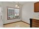 Bright dining area with a window and chandelier at 793 Shepherds Way, Greenwood, IN 46143