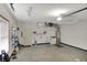 Well-lit garage with utility sink, shelving, and ample space for various activities or storage at 793 Shepherds Way, Greenwood, IN 46143