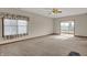 Sunlit living room featuring neutral carpet and large windows with blinds at 793 Shepherds Way, Greenwood, IN 46143