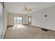 Spacious living room featuring neutral carpeting and a ceiling fan at 793 Shepherds Way, Greenwood, IN 46143