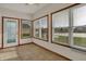 Sitting area with tile floors, lots of windows and exterior door at 793 Shepherds Way, Greenwood, IN 46143