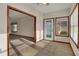 Sitting area with tile floor and an exterior door leading to the yard at 793 Shepherds Way, Greenwood, IN 46143