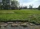 View of large backyard with open green space and rock steps at 798 S 600 W, New Palestine, IN 46163