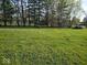 Expansive backyard with lush green grass and mature trees at 798 S 600 W, New Palestine, IN 46163