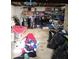 Unfinished basement with concrete flooring, shelving, clothes racks, and piles of clothing at 798 S 600 W, New Palestine, IN 46163