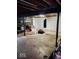 Unfinished basement with stone accent wall, exposed beams, storage space, and a hanging punching bag at 798 S 600 W, New Palestine, IN 46163