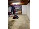 Unfinished basement featuring a stone fireplace, storage, and a hanging punching bag at 798 S 600 W, New Palestine, IN 46163