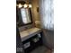 The bathroom sink area boasts updated fixtures and decor at 798 S 600 W, New Palestine, IN 46163