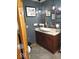 Stylish bathroom with granite countertop, dark wood vanity, and modern lighting at 798 S 600 W, New Palestine, IN 46163