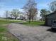 Long driveway leading up to the house surrounded by grass and trees at 798 S 600 W, New Palestine, IN 46163