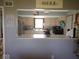 Kitchen with white cabinets and stainless steel appliances view from dining room at 798 S 600 W, New Palestine, IN 46163