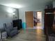 Comfortable living area with cozy chair and wood-look floors at 798 S 600 W, New Palestine, IN 46163