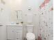 Well-lit bathroom featuring floral shower curtain at 813 Sonoma Ln, Greenfield, IN 46140