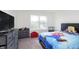 Inviting bedroom with ample natural light, carpet, playful decor and plenty of storage at 813 Sonoma Ln, Greenfield, IN 46140