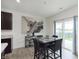 Charming dining area with table, seating, and sliding door to a fenced backyard at 813 Sonoma Ln, Greenfield, IN 46140