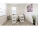 Well-lit home office featuring modern desk, stylish decor, and ample natural light from large windows at 813 Sonoma Ln, Greenfield, IN 46140