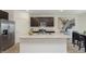 Well-appointed kitchen with stainless steel appliances, dark cabinetry, granite countertops, and a spacious island at 813 Sonoma Ln, Greenfield, IN 46140