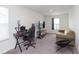 Neutral living area featuring carpet, a light-filled window, and comfortable sofa at 813 Sonoma Ln, Greenfield, IN 46140