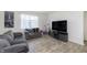 Cozy living room with couches, television and bright natural light at 813 Sonoma Ln, Greenfield, IN 46140