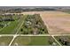 Panoramic aerial view of a home with lush greenery and farmland, offering a sense of tranquility and space at 8551 E 300 S, Zionsville, IN 46077