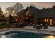 Brick home with patio, outdoor seating, lights and a pool at 8551 E 300 S, Zionsville, IN 46077