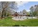 Beautiful brick home with a spacious backyard, mature trees, and an in-ground pool at 8551 E 300 S, Zionsville, IN 46077