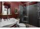 Stylish bathroom with a glass-enclosed shower, decorative mirror, and modern fixtures at 8551 E 300 S, Zionsville, IN 46077