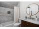 Charming bathroom with marble tile, wooden vanity, and stylish fixtures offers a luxurious retreat at 8551 E 300 S, Zionsville, IN 46077