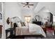 Bright bedroom featuring a ceiling fan, neutral tones, and window-lit room, creating a serene and inviting space at 8551 E 300 S, Zionsville, IN 46077