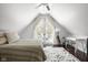 Bedroom with vaulted ceiling, plush rug, and access to a balcony, designed for restful nights and relaxing mornings at 8551 E 300 S, Zionsville, IN 46077