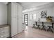 Versatile flex space with white cabinets, desk, stools, and Dolly Parton art, perfect for office, homework, or hobbies at 8551 E 300 S, Zionsville, IN 46077