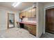 Spacious garage features built-in cabinets, a red worktop, and a door leading to another room at 8551 E 300 S, Zionsville, IN 46077