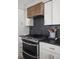 Kitchen with modern appliances, granite countertops, and custom cabinetry at 8551 E 300 S, Zionsville, IN 46077