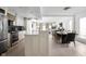 Modern kitchen with a large island, stainless steel appliances, and an open floor plan at 8551 E 300 S, Zionsville, IN 46077