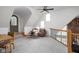 Upstairs living room with vaulted ceiling, and exposed brick creates a bright, and inviting space at 8551 E 300 S, Zionsville, IN 46077