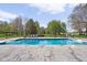 Inviting in-ground pool with lounge seating, set in a lush, expansive backyard at 8551 E 300 S, Zionsville, IN 46077