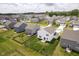Aerial view of a fenced backyard in a neighborhood with green spaces and well-kept homes at 8654 Tripp Rd, Pendleton, IN 46064