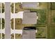 Bird's eye view of symmetrical homes featuring manicured lawns and driveways at 8654 Tripp Rd, Pendleton, IN 46064